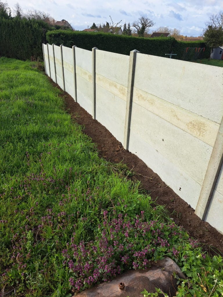 pose de clôture béton
